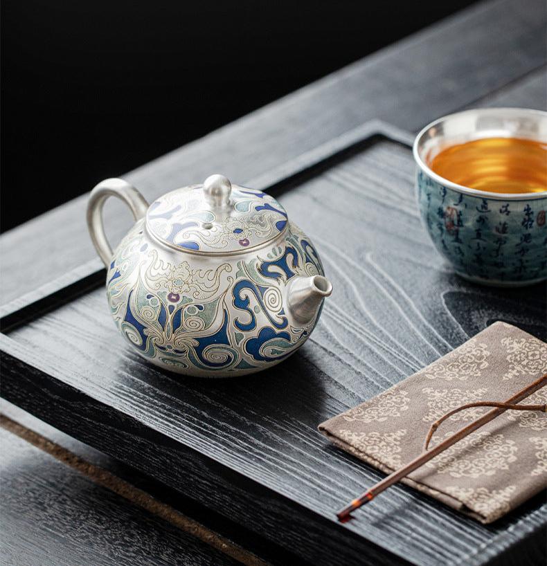 This is a gilded silver teapot. This is a ceramic teapot