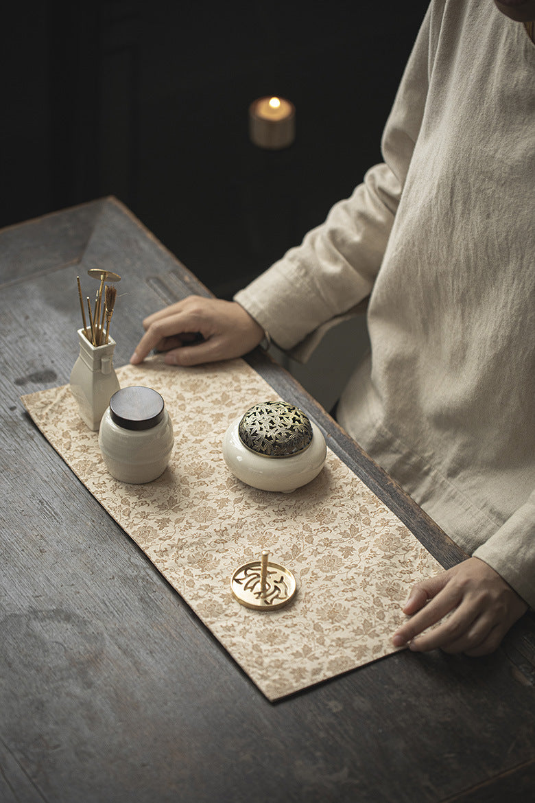 This is a silk brocade tea mat. this is a waterproof table cloth