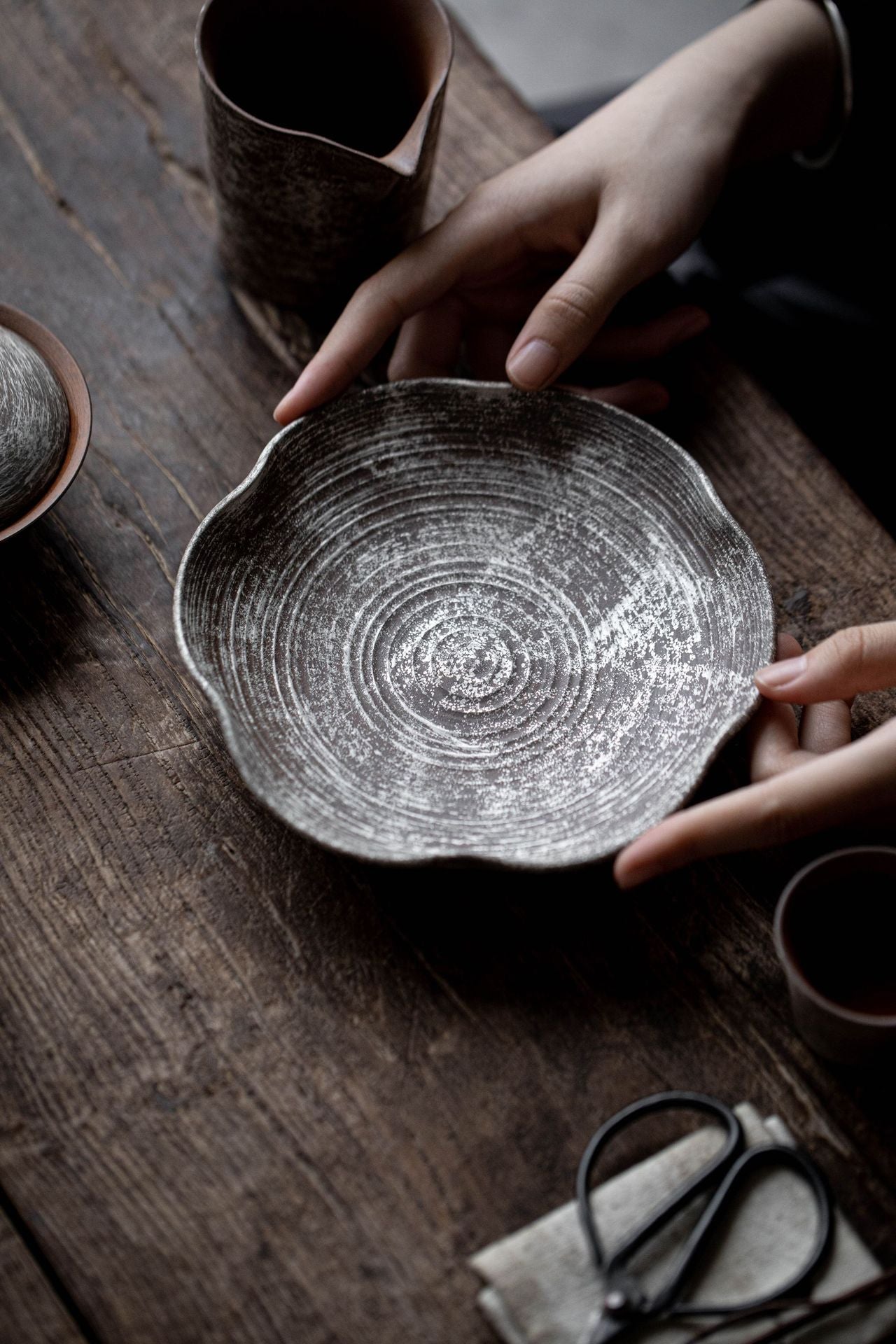 This is a gilted silver pottery teapot
