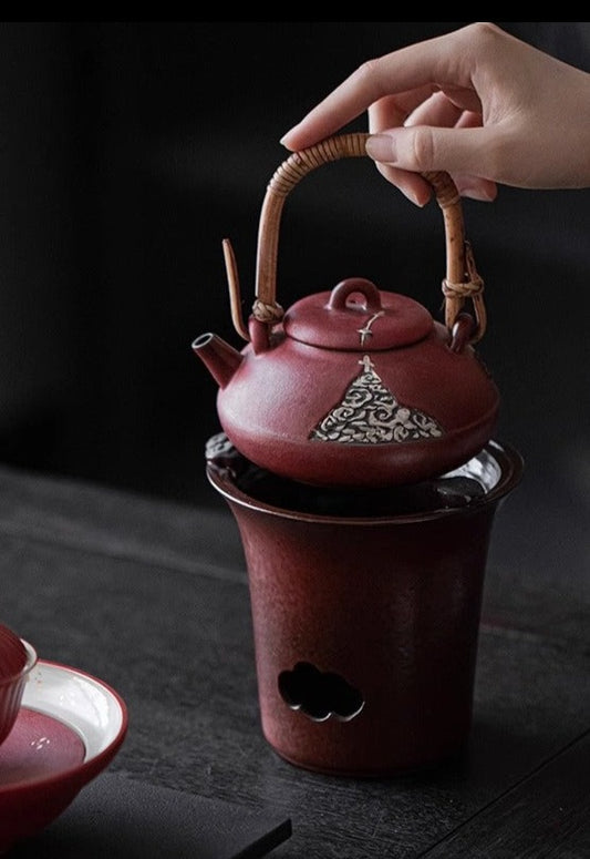 This is a pottery lifting handle kettle