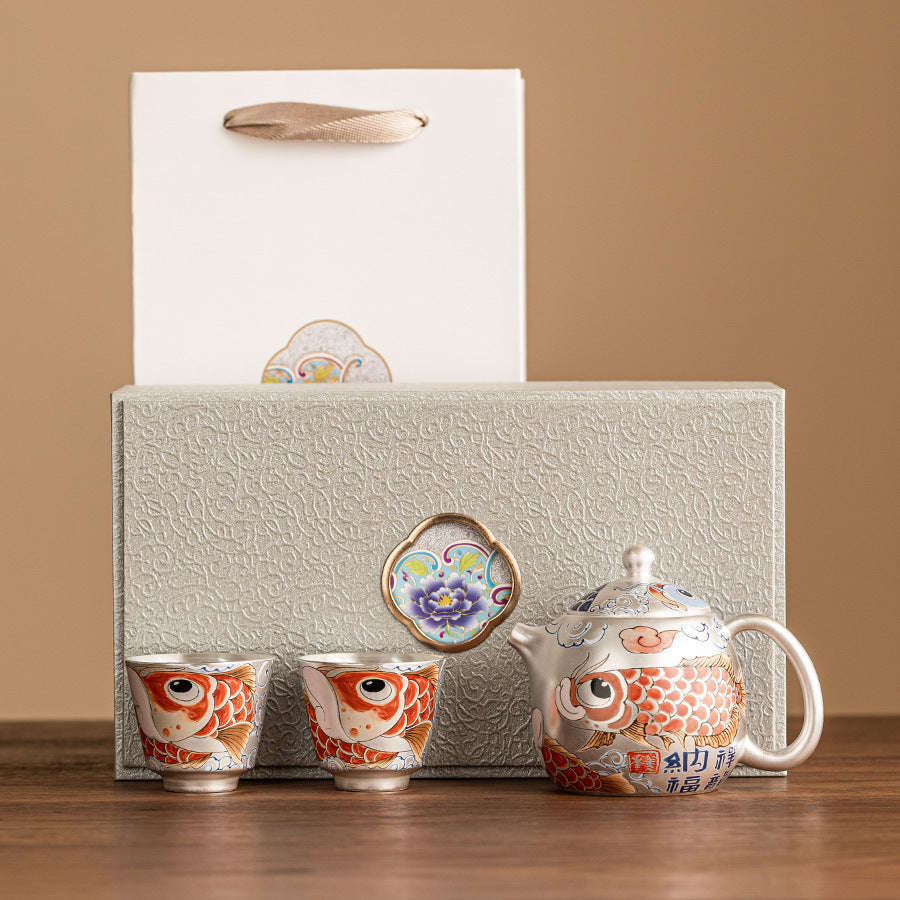 this is a gilded silver teapot. this is a ceramic teapot