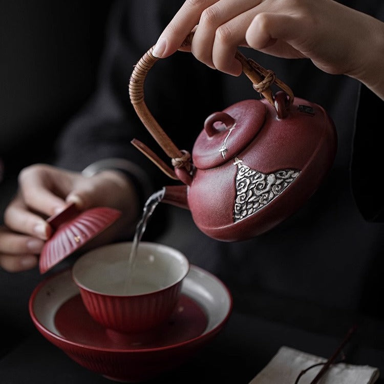 This is a pottery lifting handle kettle