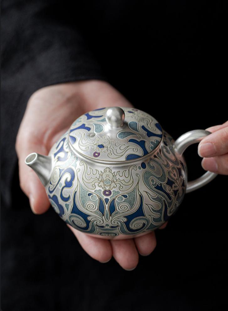 This is a gilded silver teapot. This is a ceramic teapot
