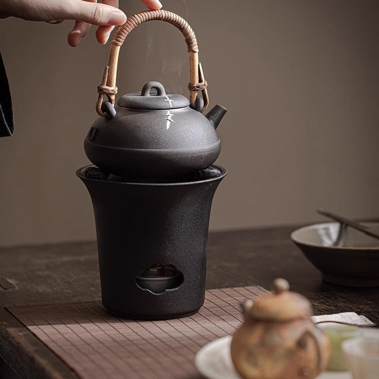 This is a pottery lifting handle kettle