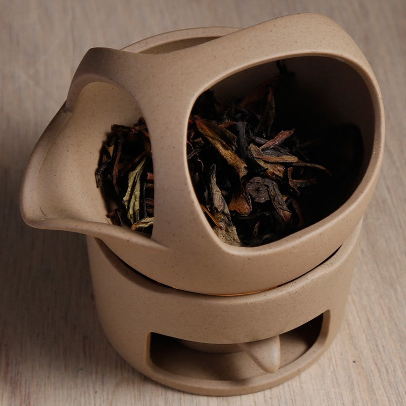This is a ceramic scoop warmer set