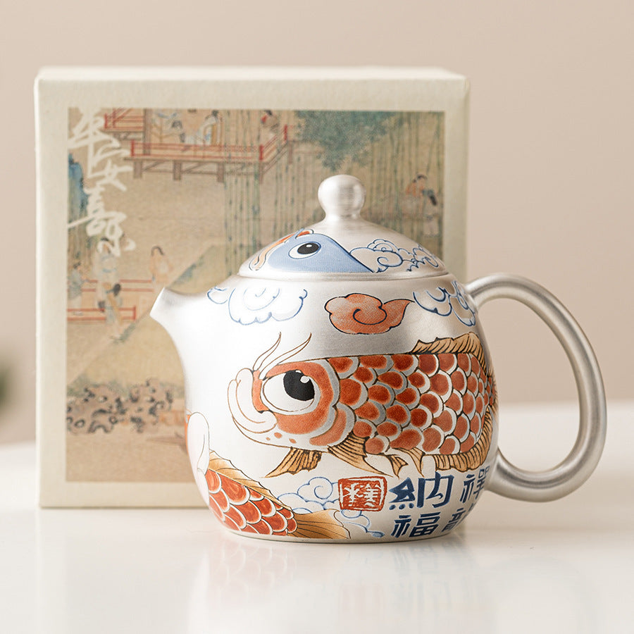 this is a gilded silver teapot. this is a ceramic teapot