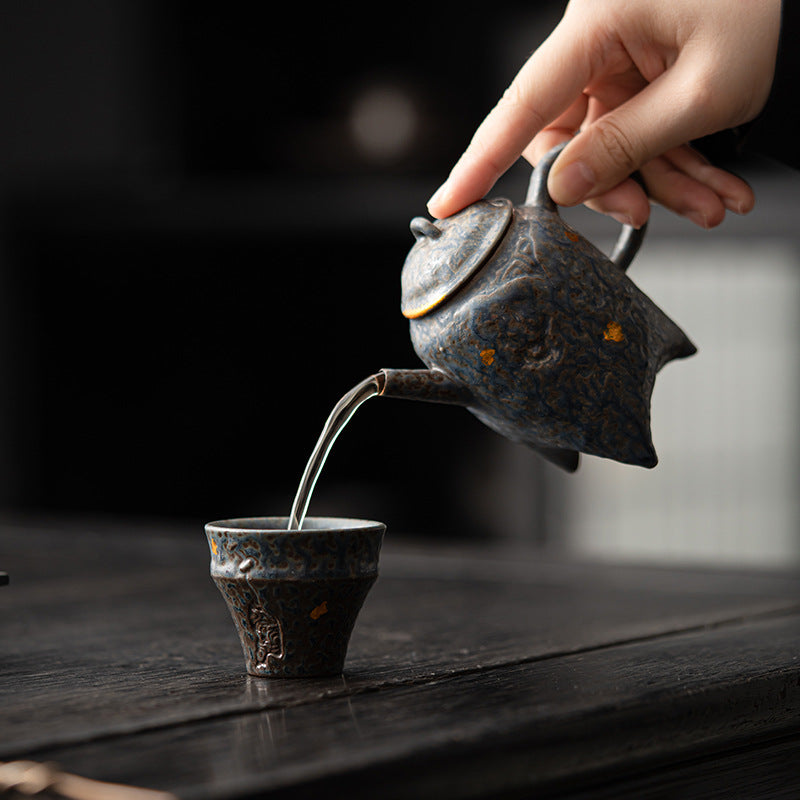 this is a crude pottery teapot