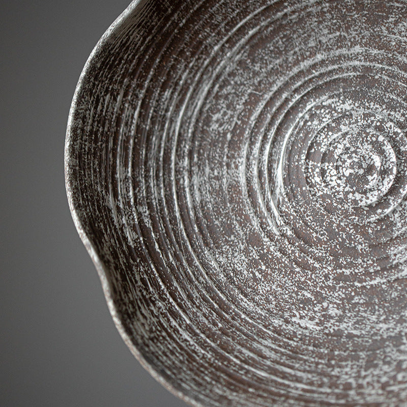 This is a gilted silver pottery teapot