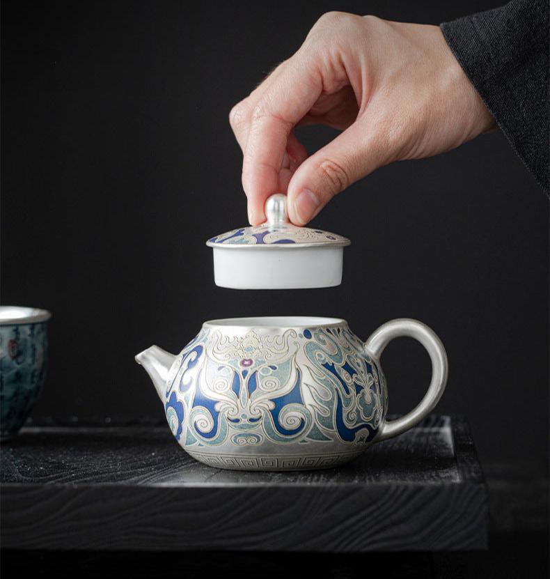 This is a gilded silver teapot. This is a ceramic teapot