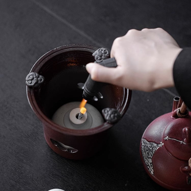 This is a pottery lifting handle kettle