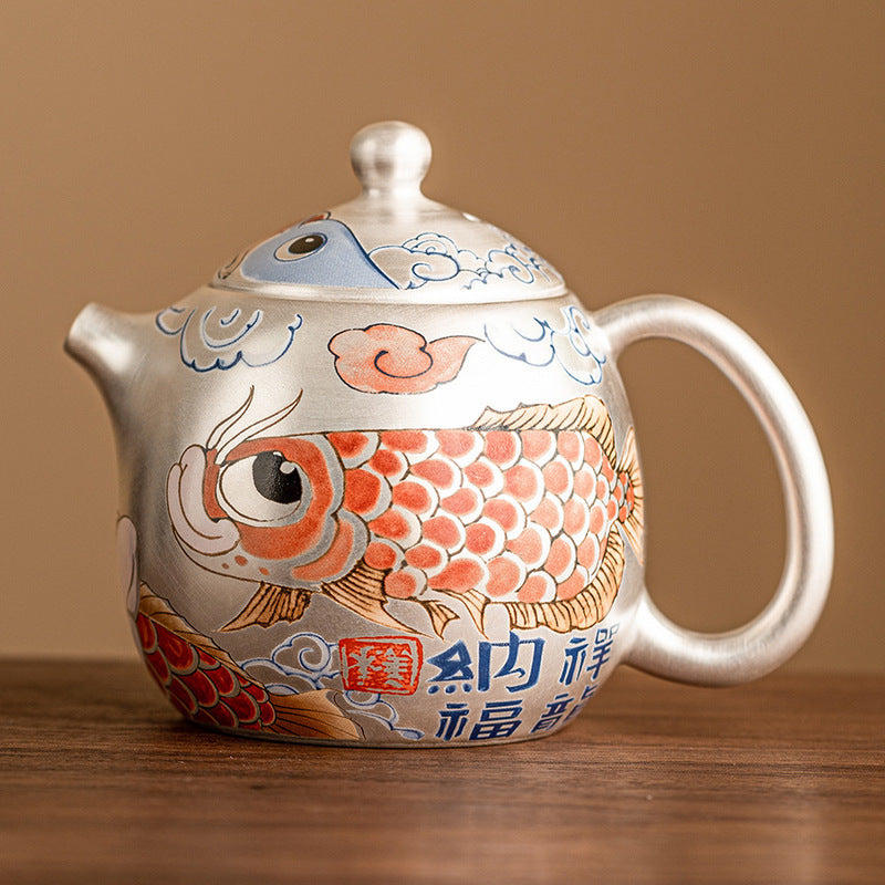 this is a gilded silver teapot. this is a ceramic teapot