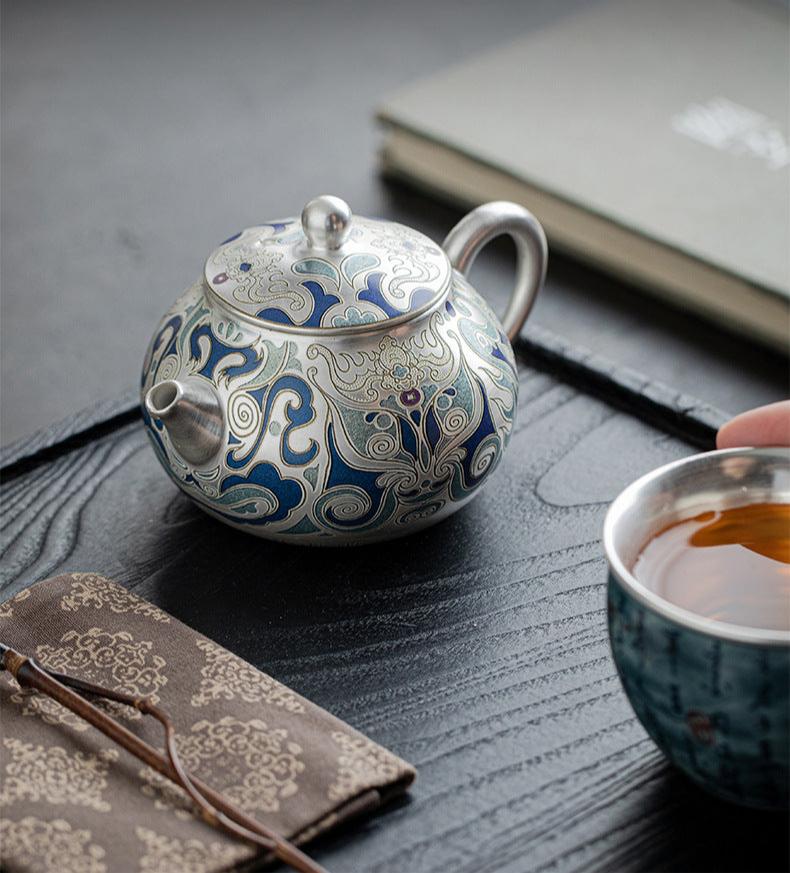 This is a gilded silver teapot. This is a ceramic teapot