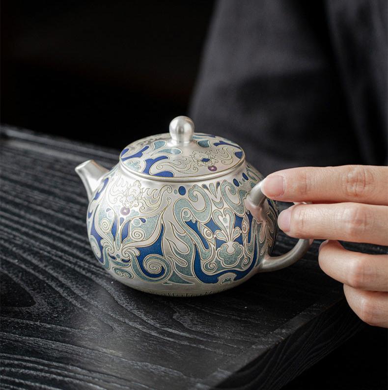 This is a gilded silver teapot. This is a ceramic teapot