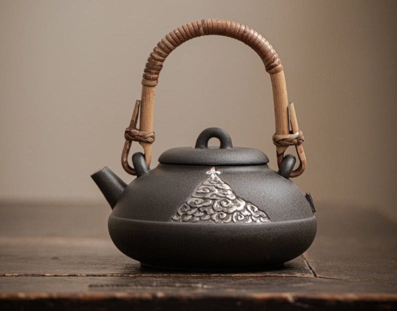 This is a pottery lifting handle kettle