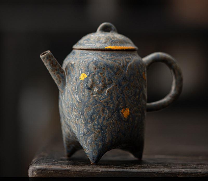 this is a crude pottery teapot