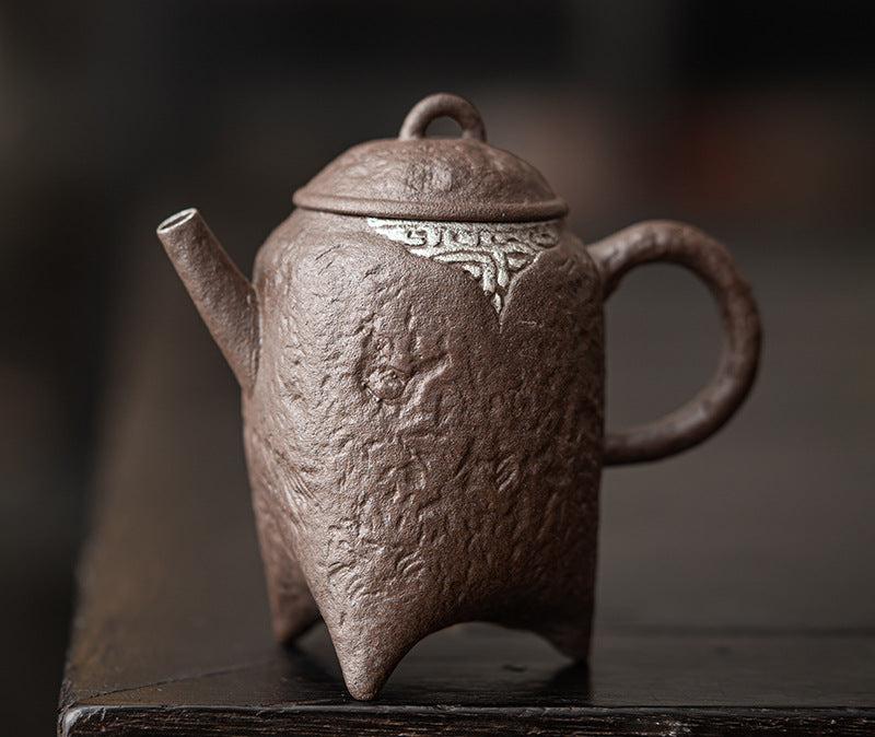 this is a crude pottery teapot