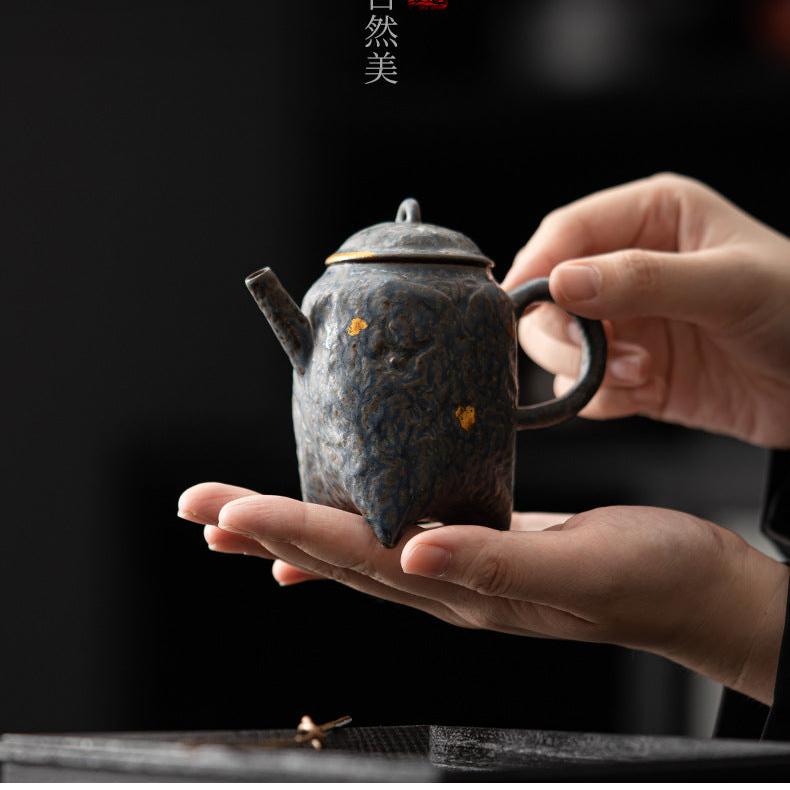 this is a crude pottery teapot