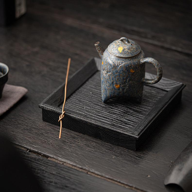 this is a crude pottery teapot