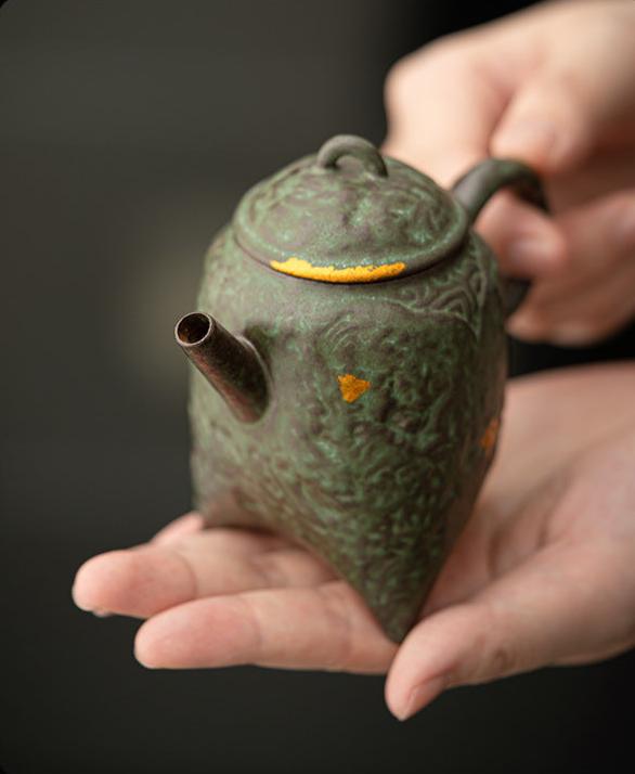 this is a crude pottery teapot