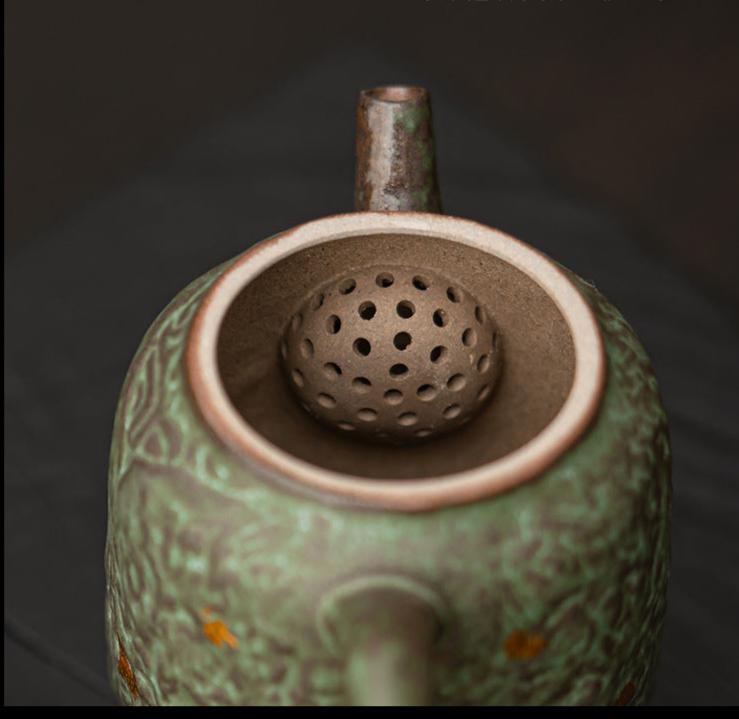 this is a crude pottery teapot