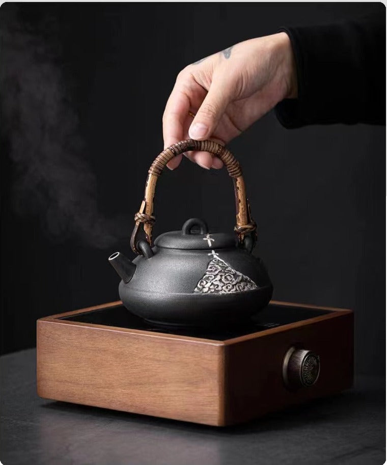 This is a pottery lifting handle kettle