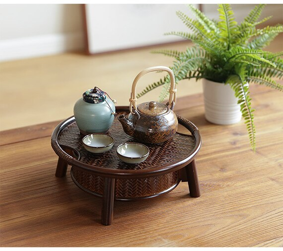 This is a bamboo weaving storage tea table.this is a black tea table