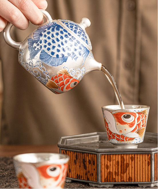 this is a gilded silver teapot. this is a ceramic teapot