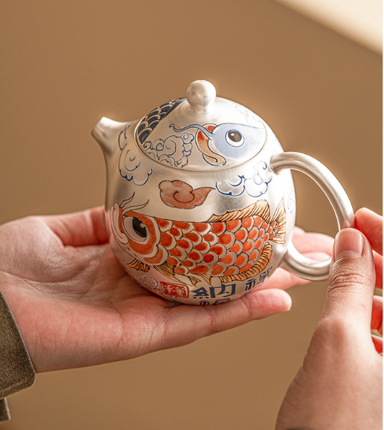 this is a gilded silver teapot. this is a ceramic teapot