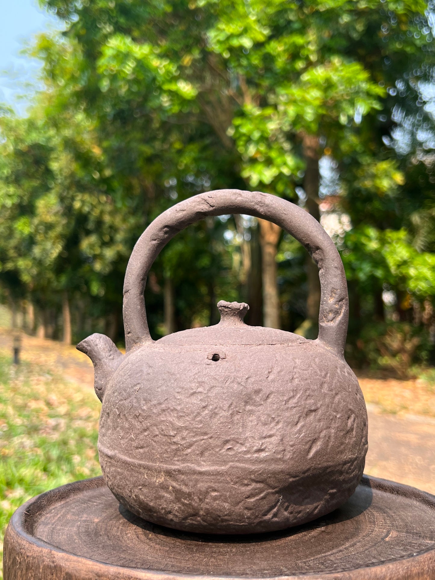 This is a pottery lifting handle kettle