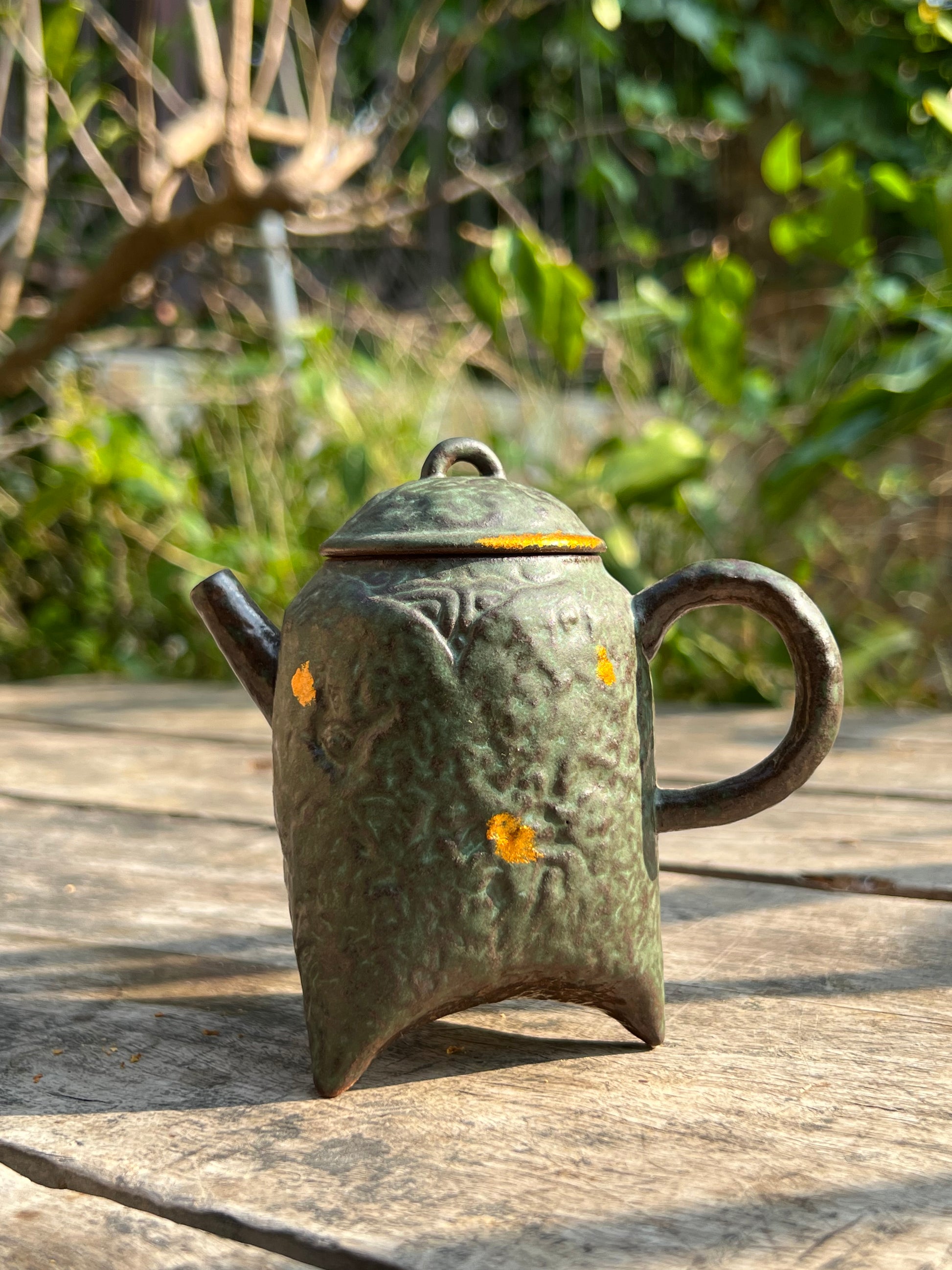 this is a crude pottery teapot