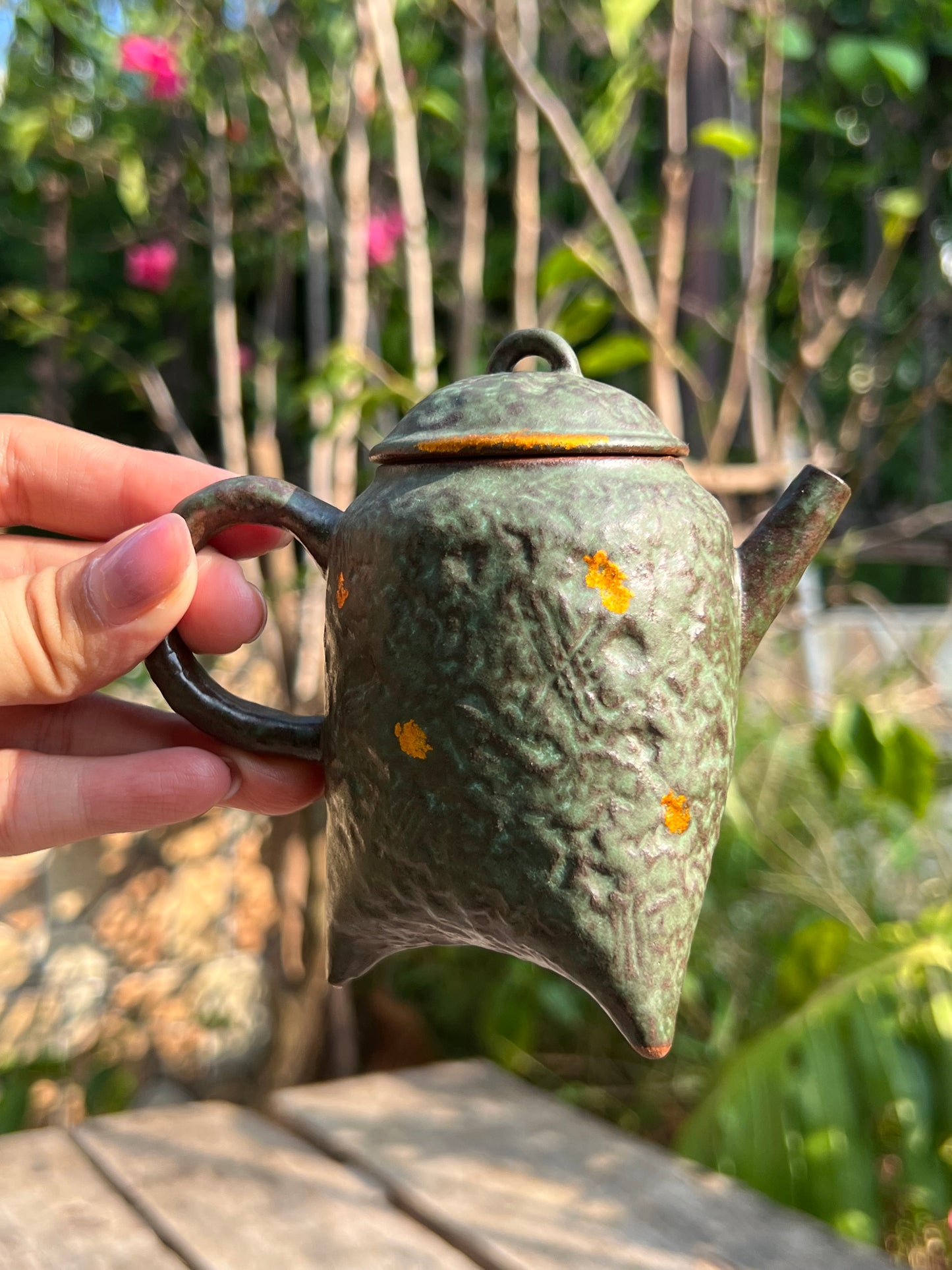 this is a crude pottery teapot