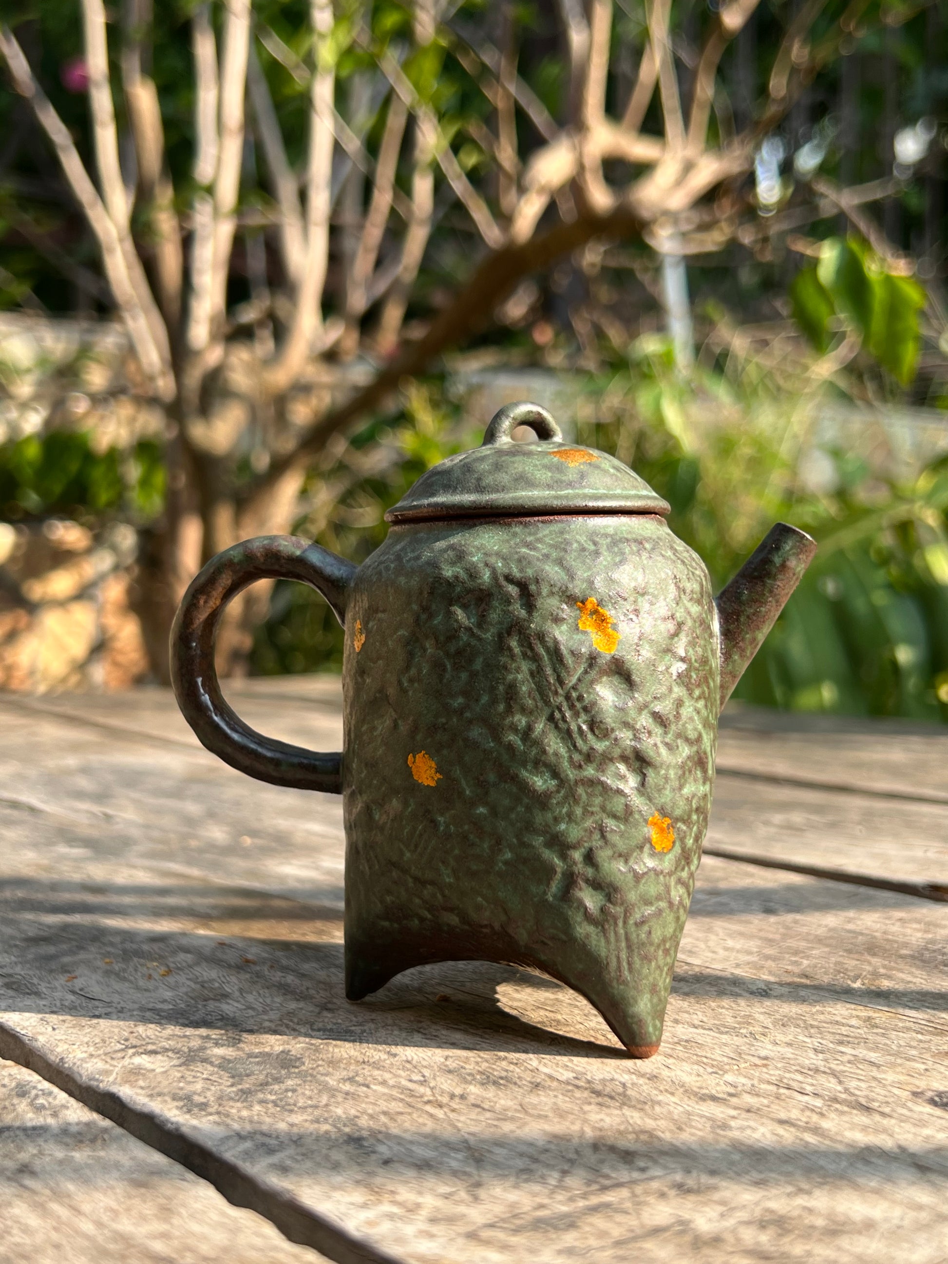 this is a crude pottery teapot