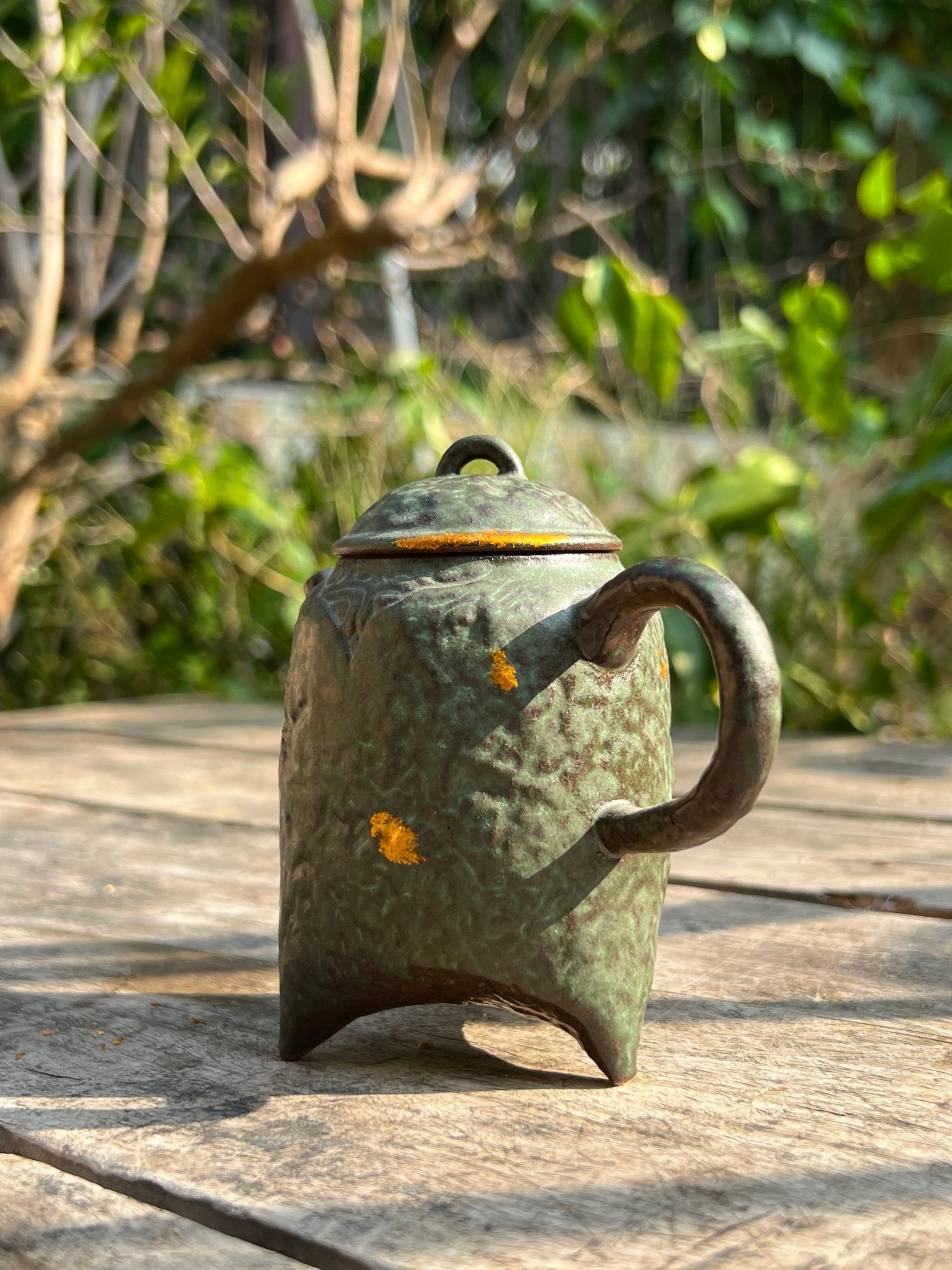 this is a crude pottery teapot