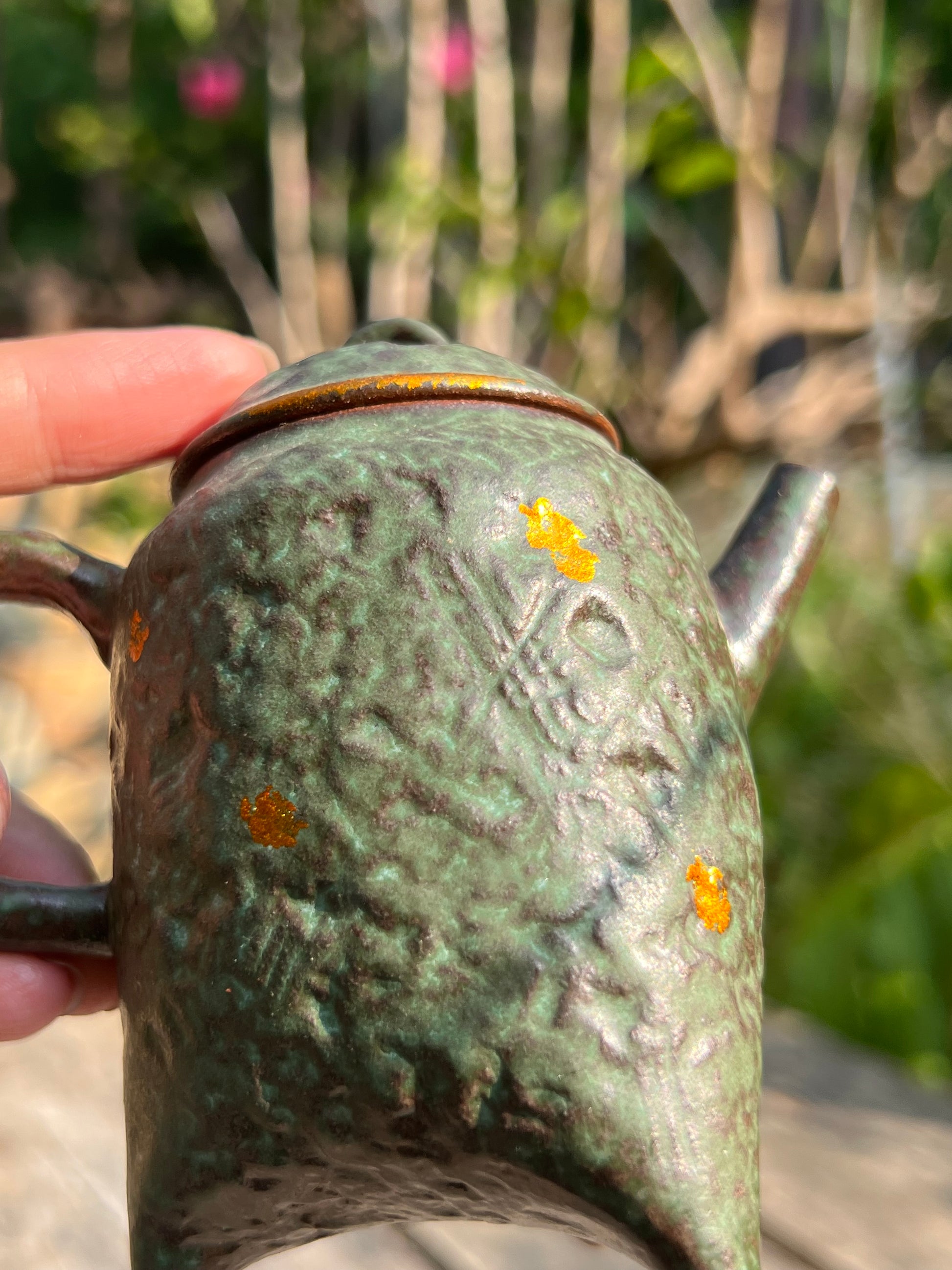 this is a crude pottery teapot