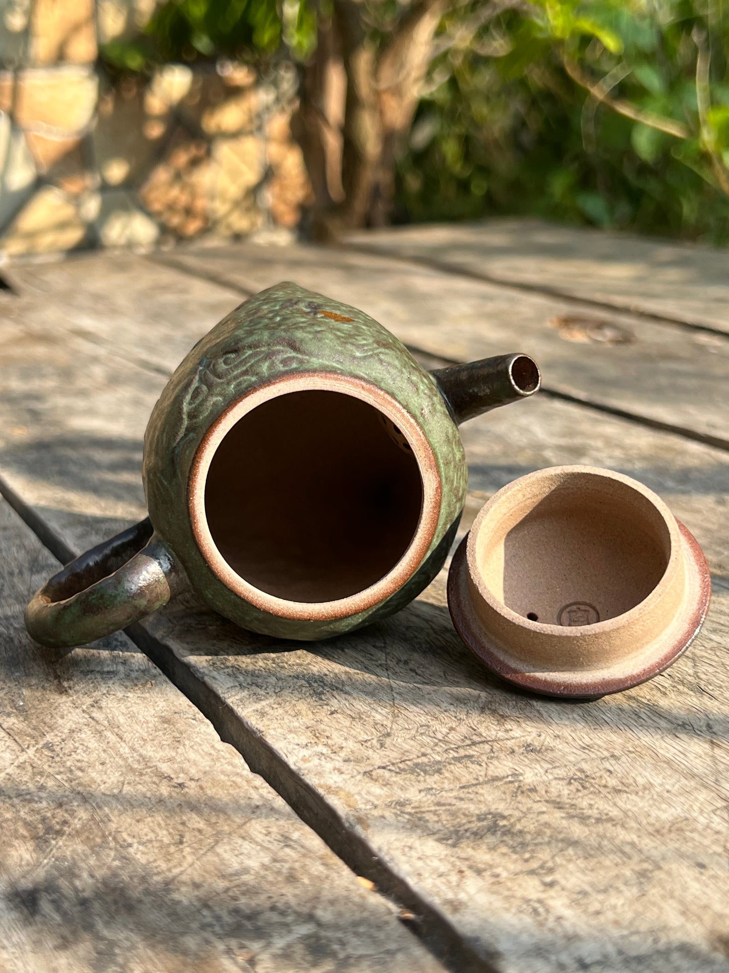 this is a crude pottery teapot