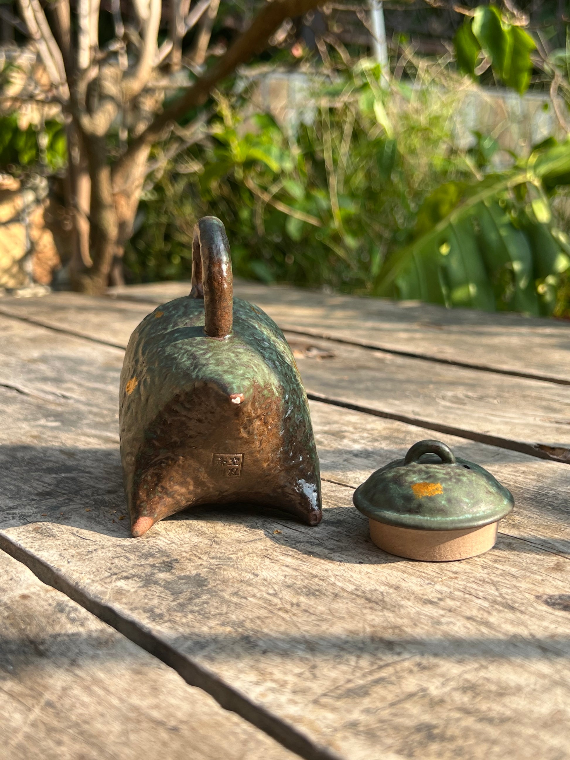 this is a crude pottery teapot