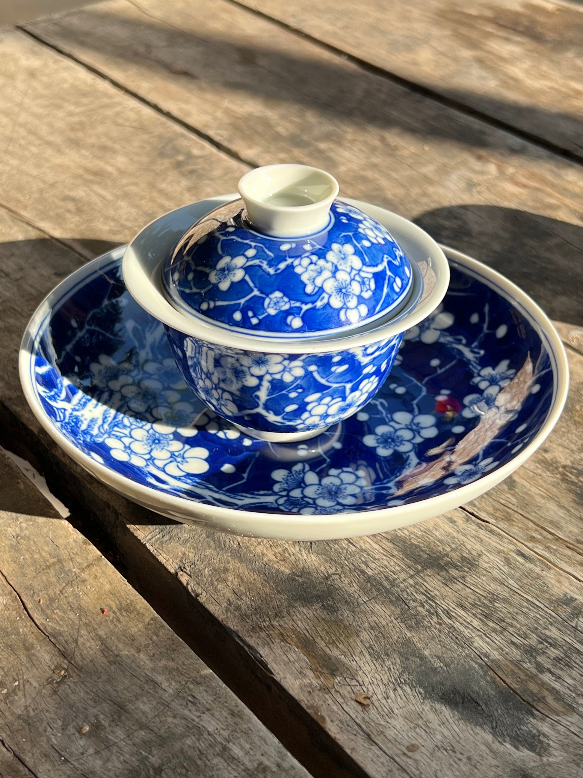 This is Chinese Jingdezhen blue and white porcelain gaiwan. This is a ceramic plum flower teapot