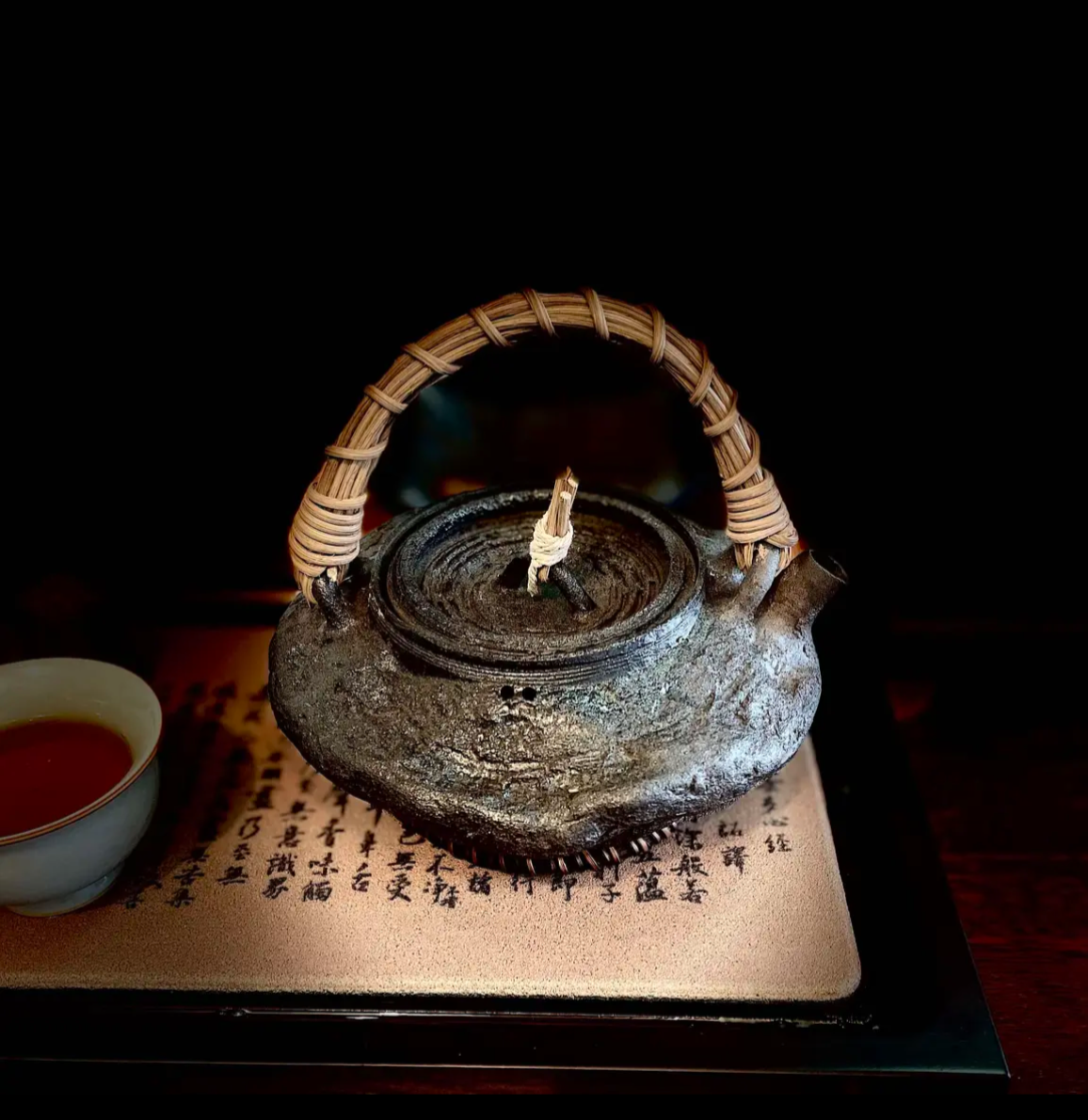 This is a pottery lifting handle kettle