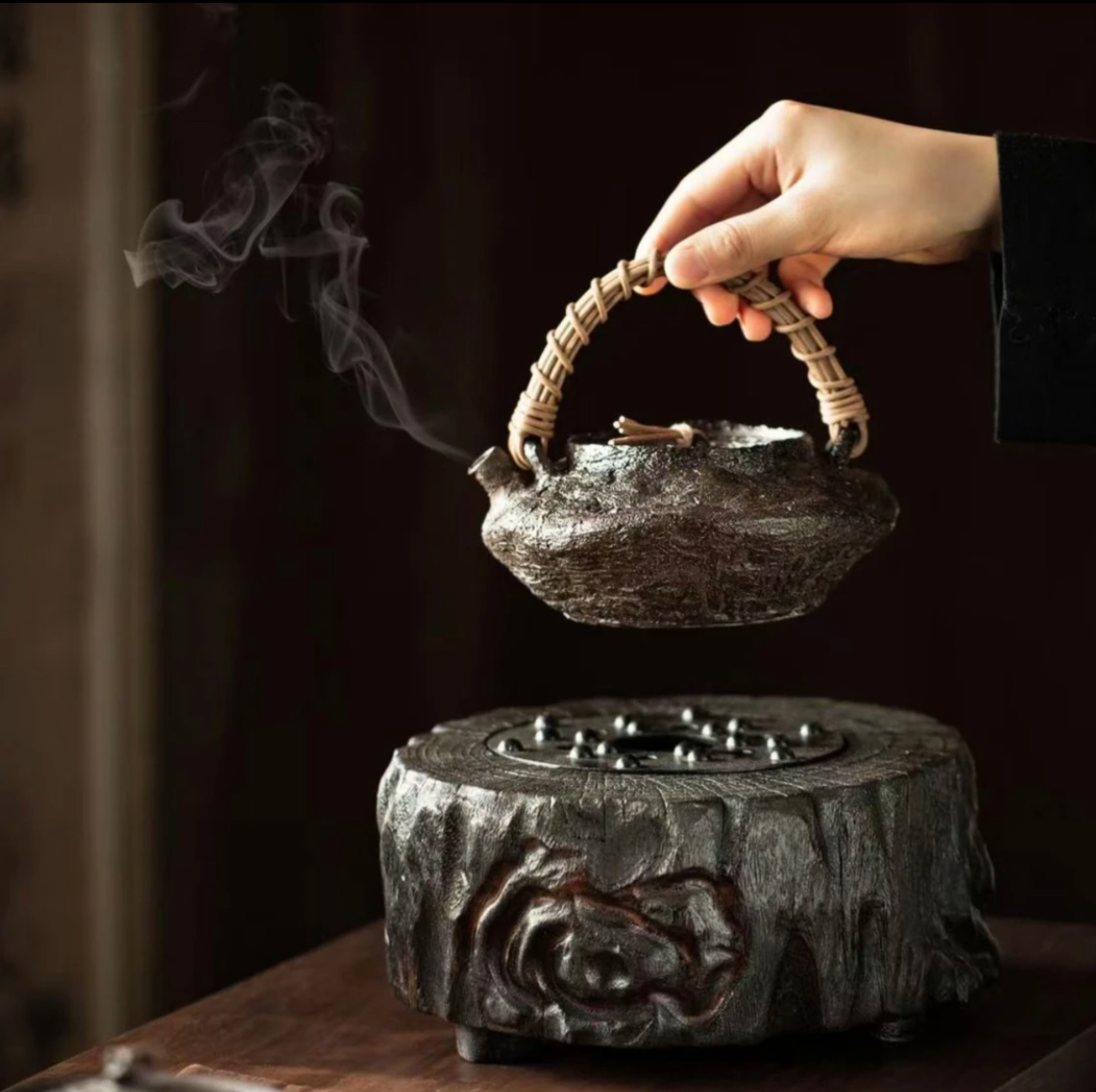 This is a pottery lifting handle kettle