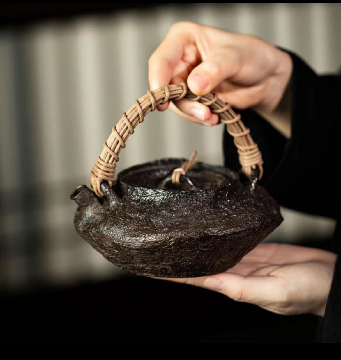 This is a pottery lifting handle kettle