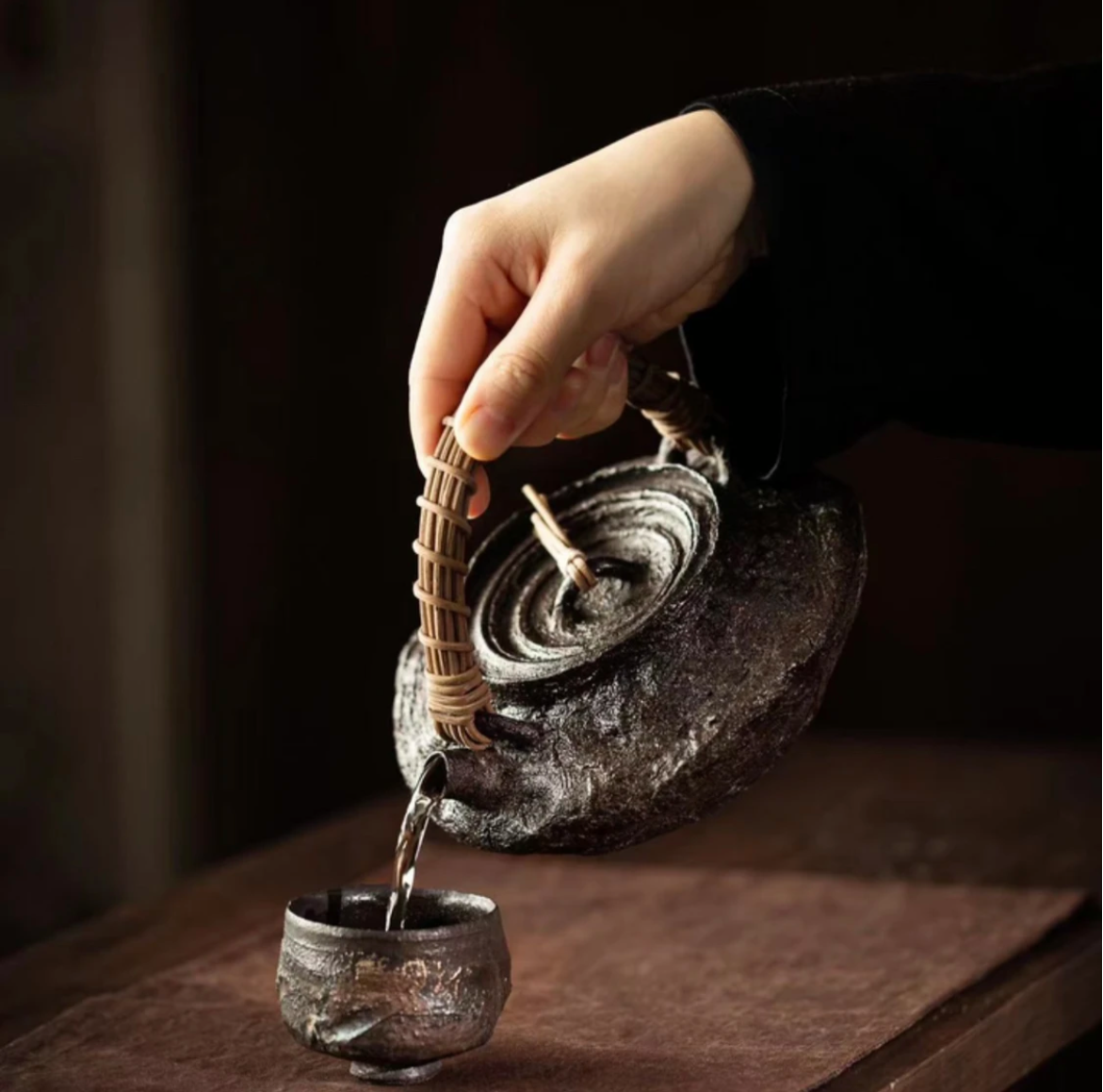 This is a pottery lifting handle kettle