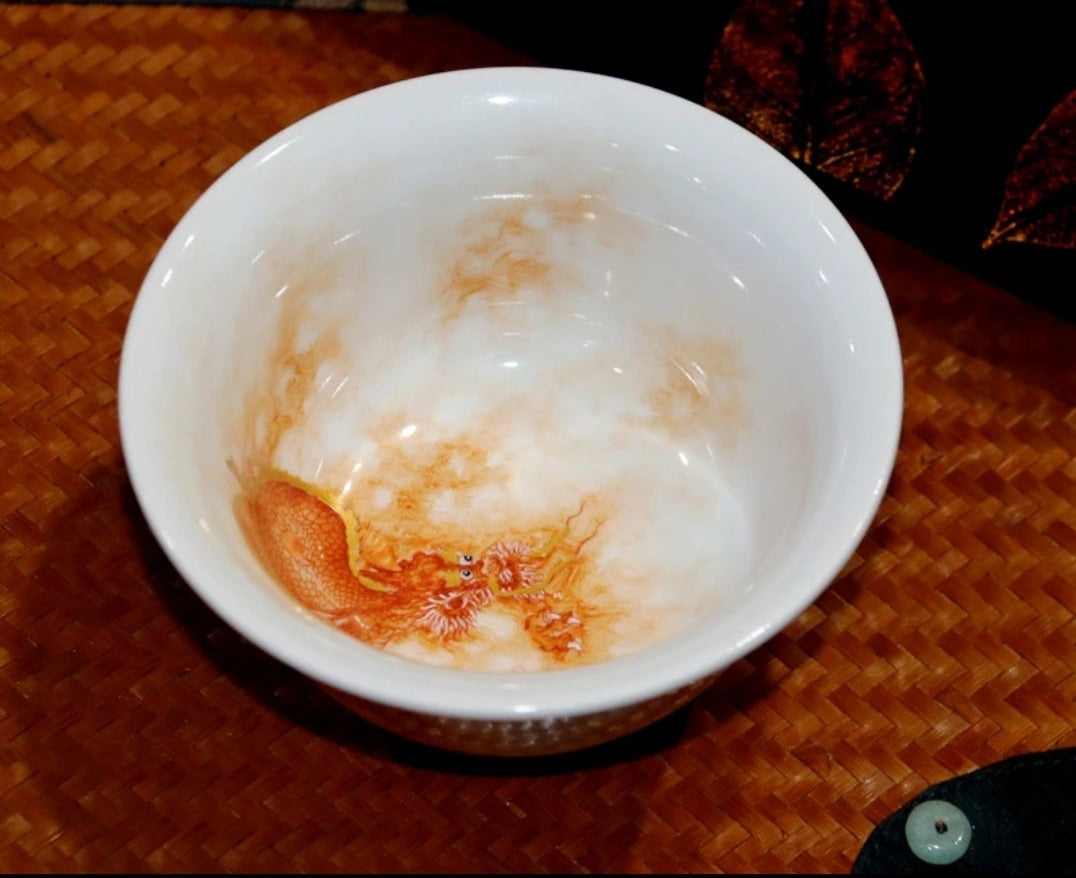 this is a Chinese Jingdezhen alum red dragon phoenix teacup.this is a ceramic teacup