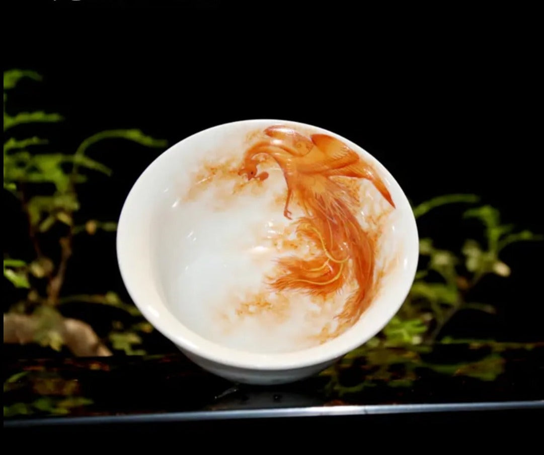 this is a Chinese Jingdezhen alum red dragon phoenix teacup. this is a ceramic teacup