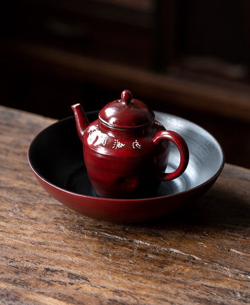 This is a pottery teapot