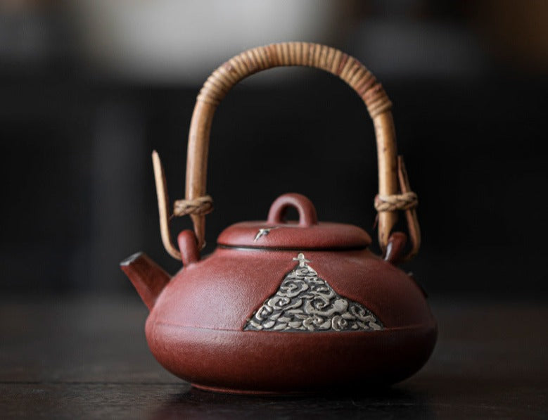 This is a pottery lifting handle kettle