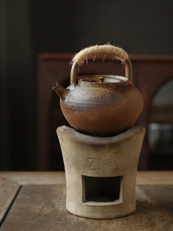 This is a pottery lifting handle kettle
