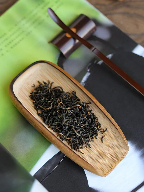 This is a bamboo tea scoop