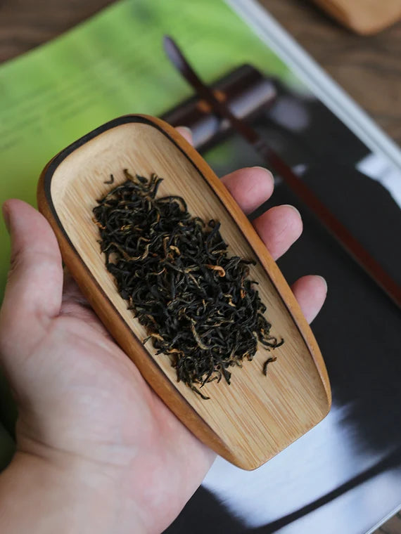This is a bamboo tea scoop