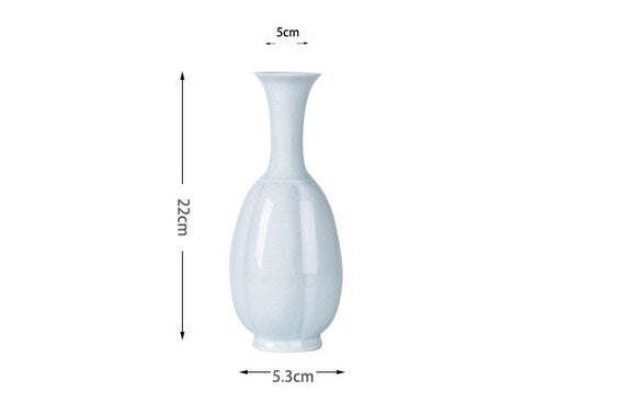 This is a celadon ceramic vase flower arrangement vessel