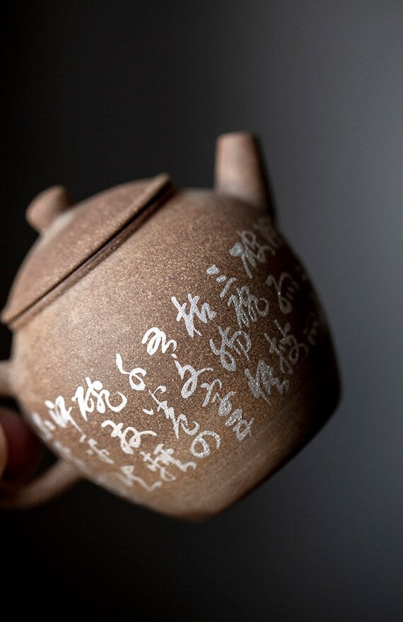This is a pottery teapot